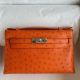 Hermes Kelly Pochette Handmade Bag in Orange Ostrich Leather