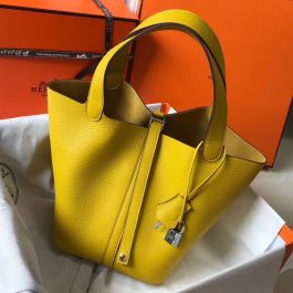 Replica Hermes Picotin LoCrafted from the Hermes's yellow taurillon  Clemence leather, this Picotin Lock 18 bag looks more like a small buckle  bag, take the handles, load it with your personal items